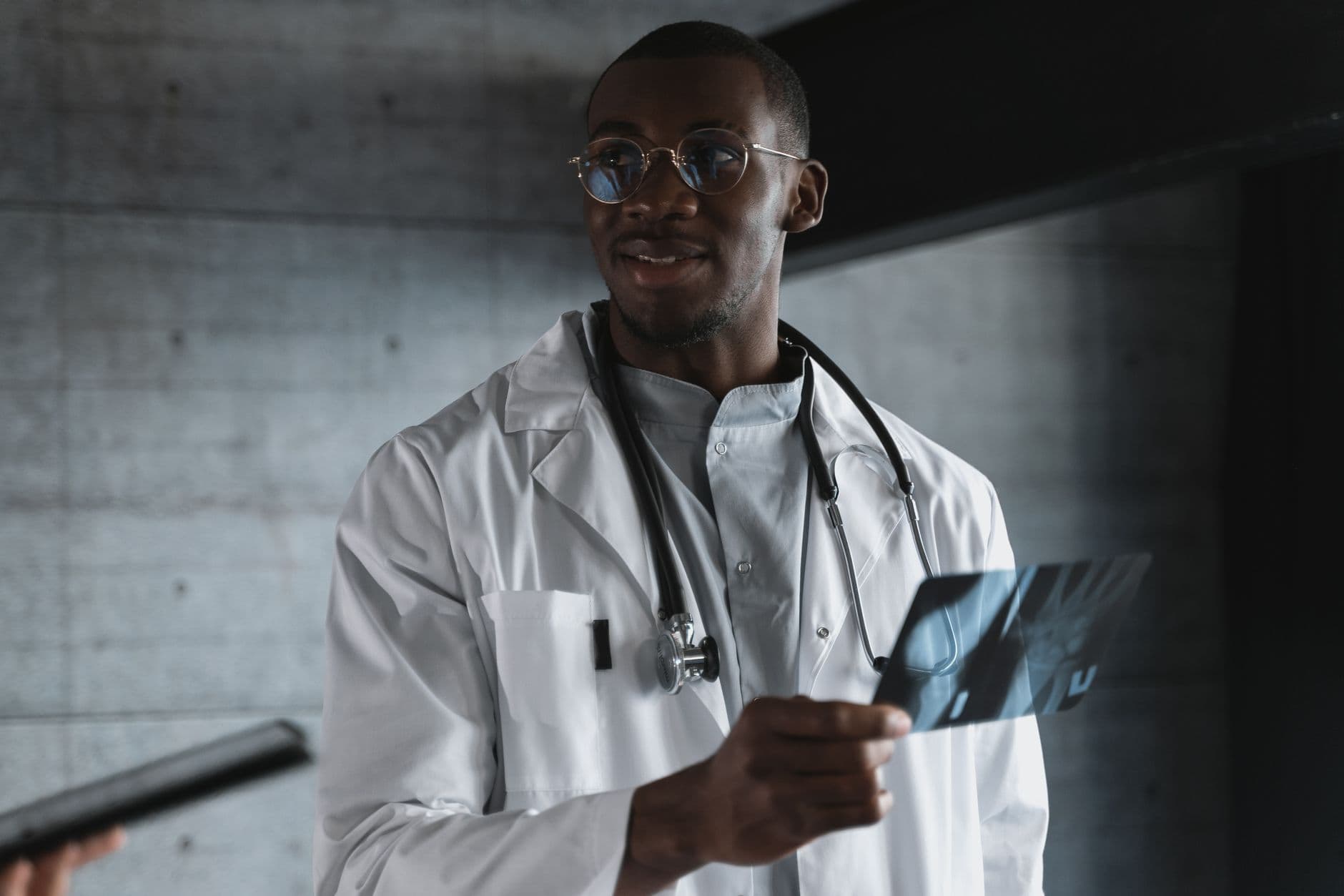 African doctor examining an X-ray