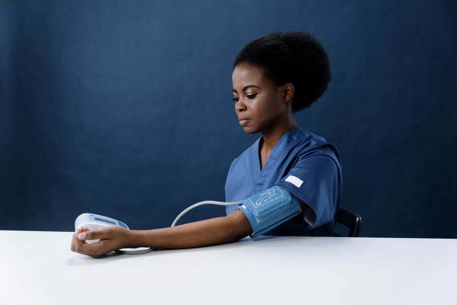 Nurse taking a blood pressure reading