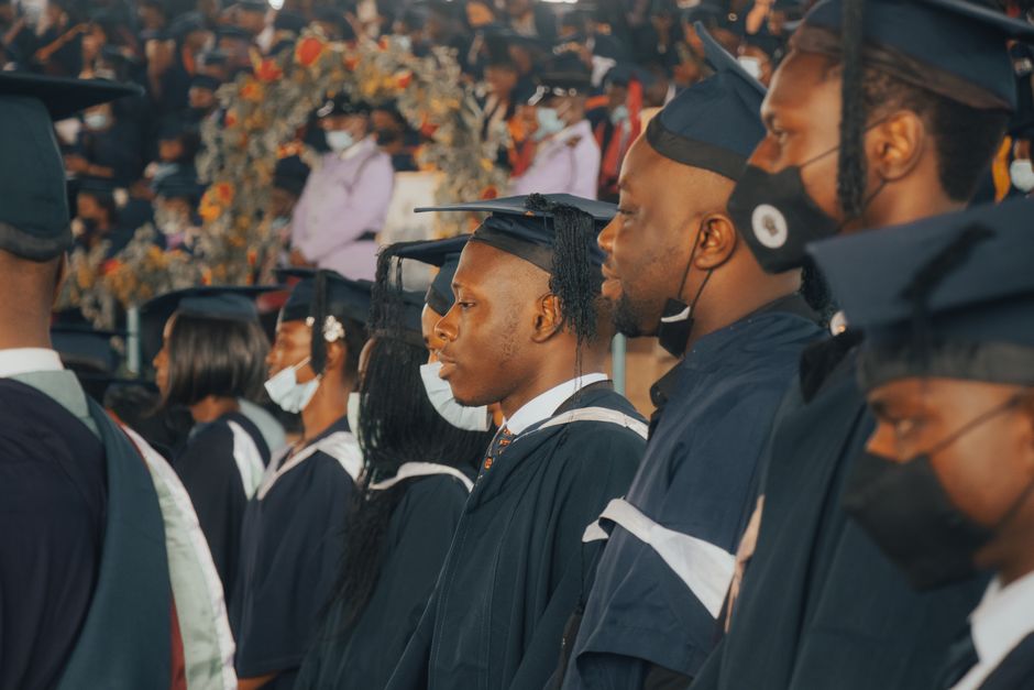 Graduates celebrating in gowns